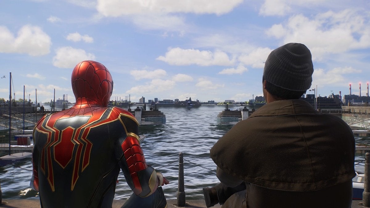 Peter sitting next to Howard on a dock in Spider-Man 2. Both are staring across a body of water.