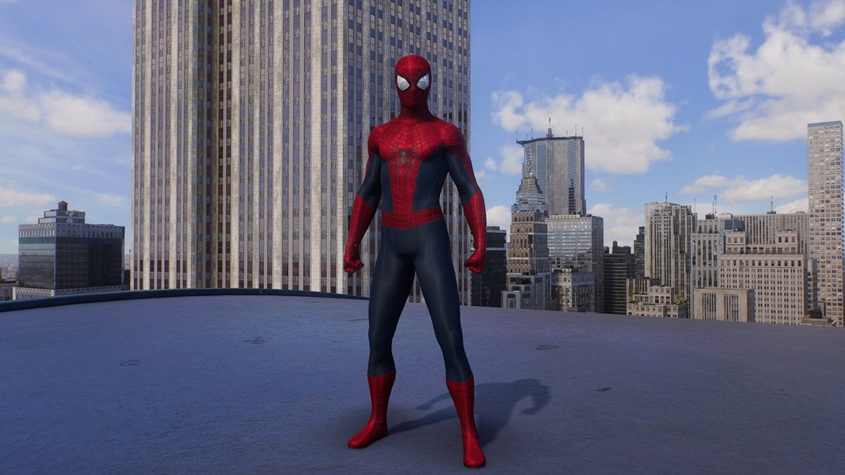 Peter Parker wearing the Amazing Suit 2, which is red and dark blue with white eye pieces and a black spider on the chest.
