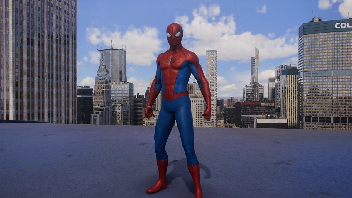 Peter Parker wearing the Classic Suit, which s red and blue with a small black spider on the chest.