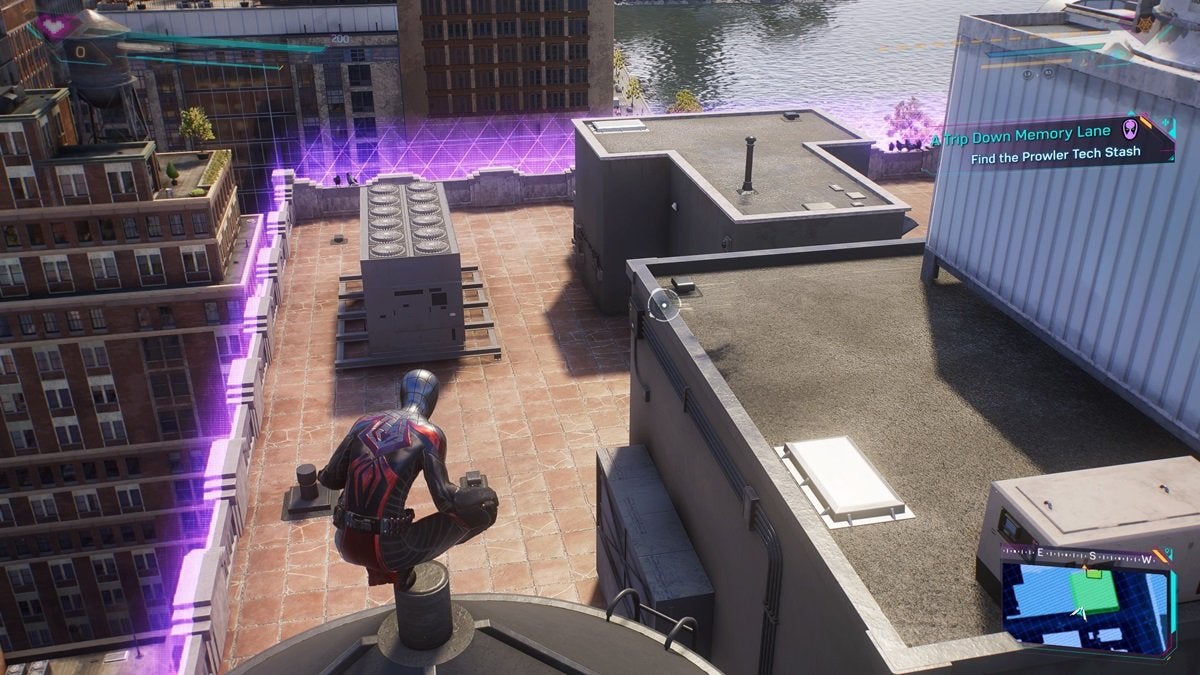 Miles looking for a Prowler Stash within an area on top of a building surrounded by a purple energy barrier in Spider-Man 2.
