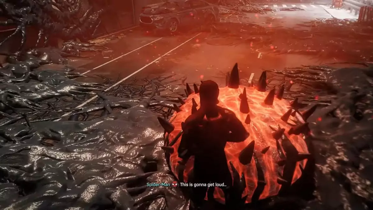 Peter exterminating an orange Symbiote Nest covered in black spikes in Spider-Man 2.
