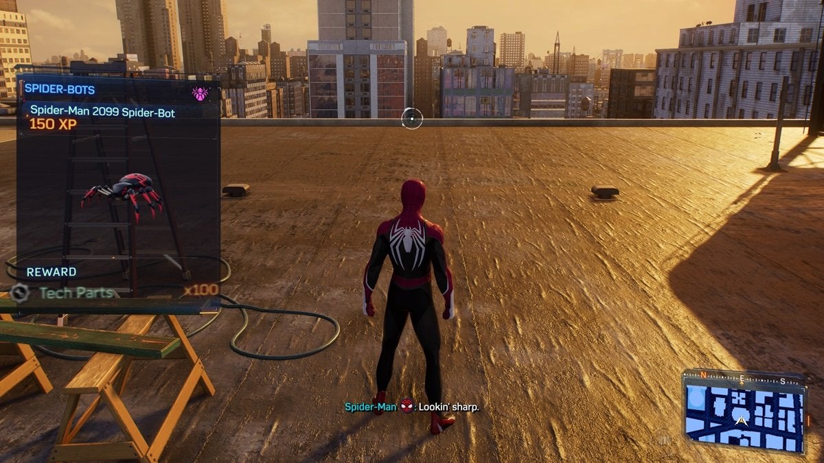Peter picking up a Spider-Bot in Spider-Man 2 while standing on a roof at sunset.