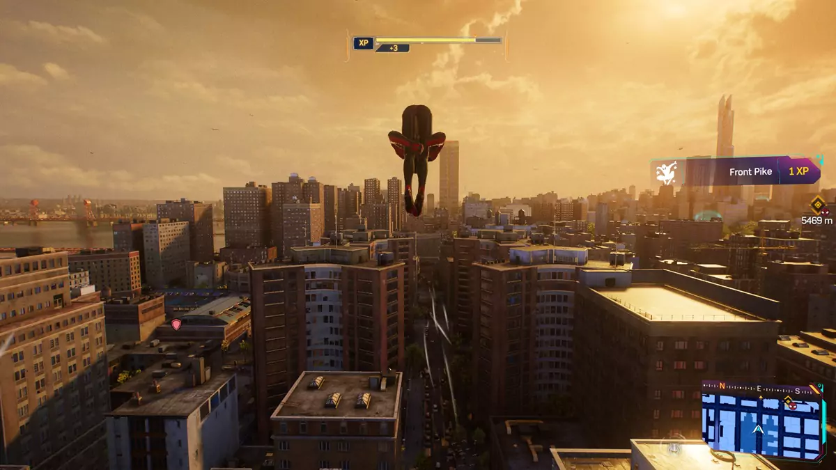 Spider-Man performing a Front Pike air trick in Spider-Man 2, which involves him flipping forward while holding his legs.
