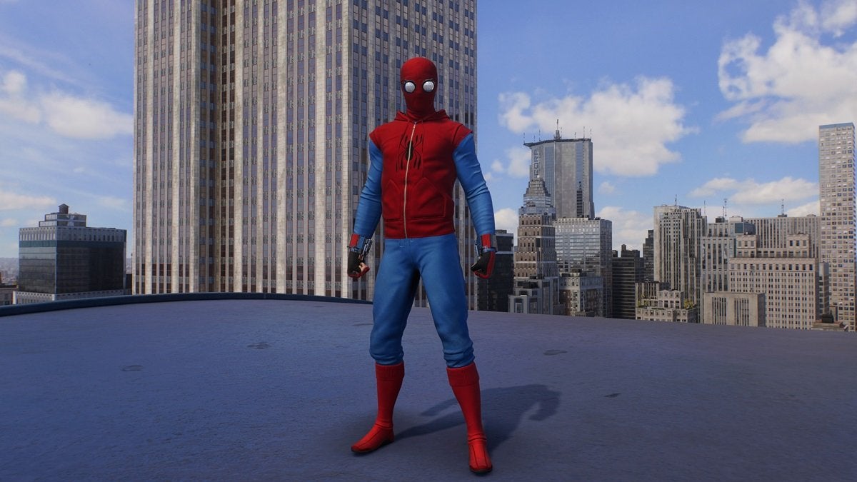 Peter Parker wearing the Homemade Suit, which is red and blue with a small black spider on the chest. The suit looks like it's made from normal clothing as opposed to being specially made for fighting crime.