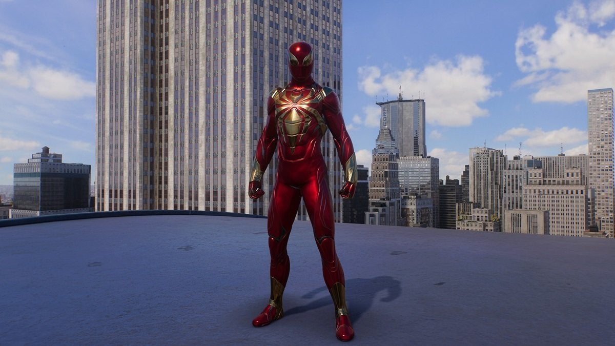Peter Parker wearing the Iron Spider Armor, which looks like Iron Man's armor. This suit is red and gold with a large golden spider on the chest.