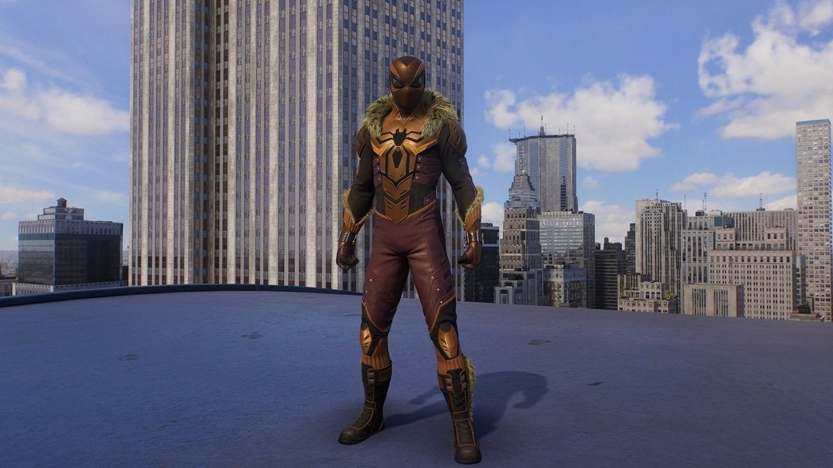 Peter Parker wearing the Last Hunt Suit, which is monochromatic brown with a large stylized black spider int he chest. There's also fur around the shoulders and forearms of the suit.