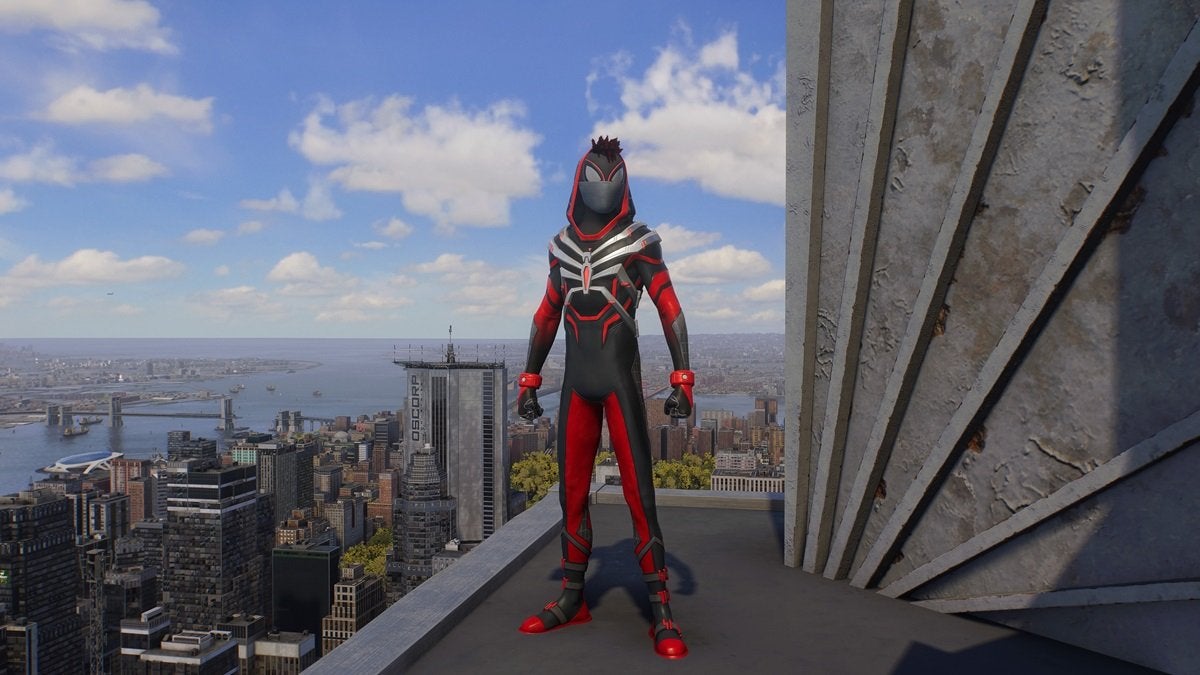 Miles Morales wearing the Red Spectre Suit, which is red, black, and gray. It comes with a hood that doesn't fully cover the head and lets a bit of Miles' short black hair peak out.