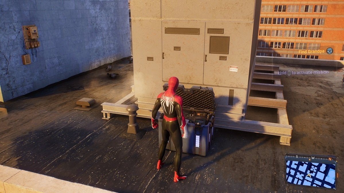 Peter picking up resources from a stash in Spider-Man 2 while on the roof of a building.