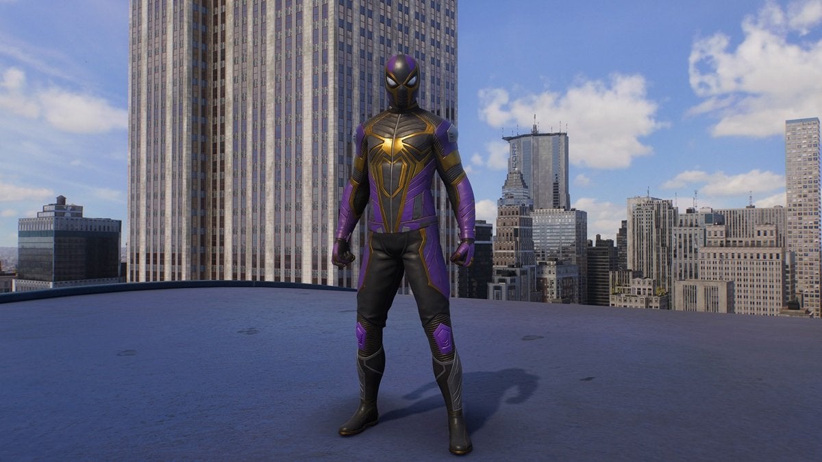 Peter Parker wearing the Saving Lives suit, which is black, purple, and gold with a golden spider on the chest.