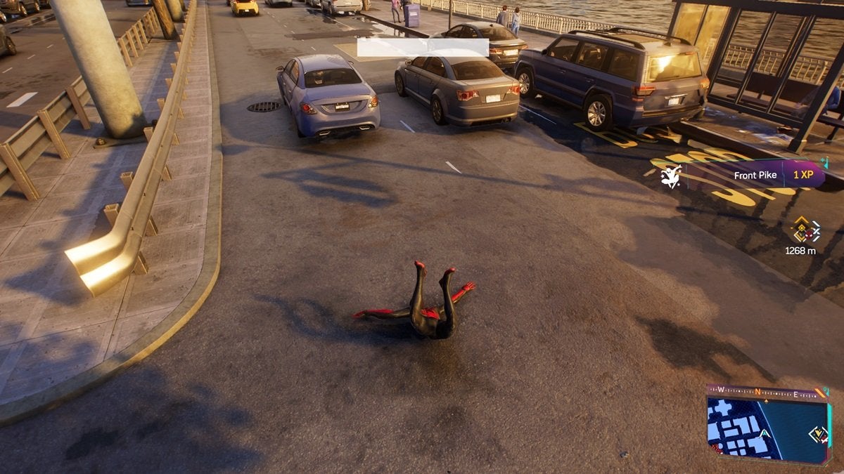 Spider-Man falling and hitting the ground in Spider-Man 2. He lands face-first on a street near to some cars.