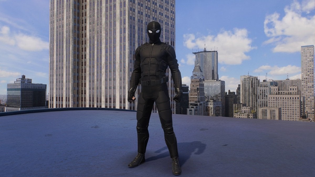 Peter Parker wearing the Stealth Suit, which looks like a Special Operative suit from the military. It's all black and lacks web designs and a spider logo.
