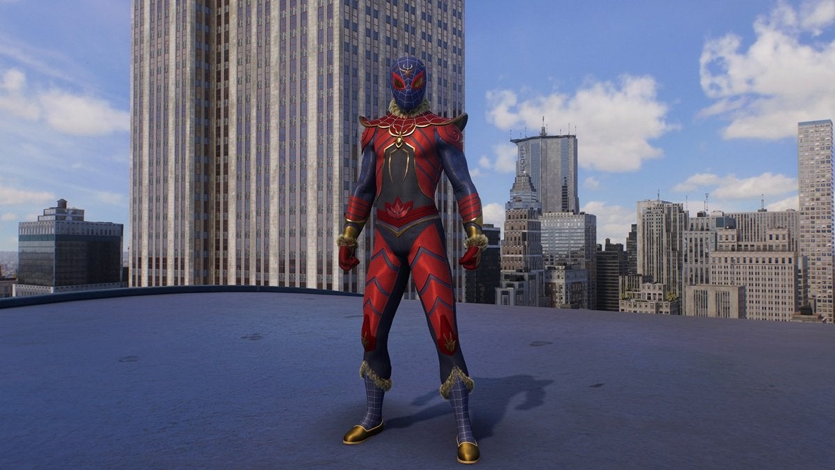 Peter Parker wearing the Stone Monkey Suit, which is black, red, blue, and gold with notable pointed shoulder pads. There's also fur trim around the neck, wrists, and calves.