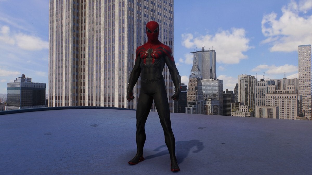 Peter Parker wearing the Superior Suit, which is mostly black with a bit of red around the head and shoulders. The spider on the chest is large and black—as are the eye pieces.