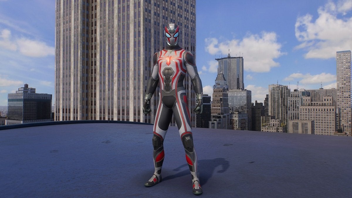 Peter Parker wearing the Tactical Suit, which looks futuristic and is colored white, gray, black, and red.