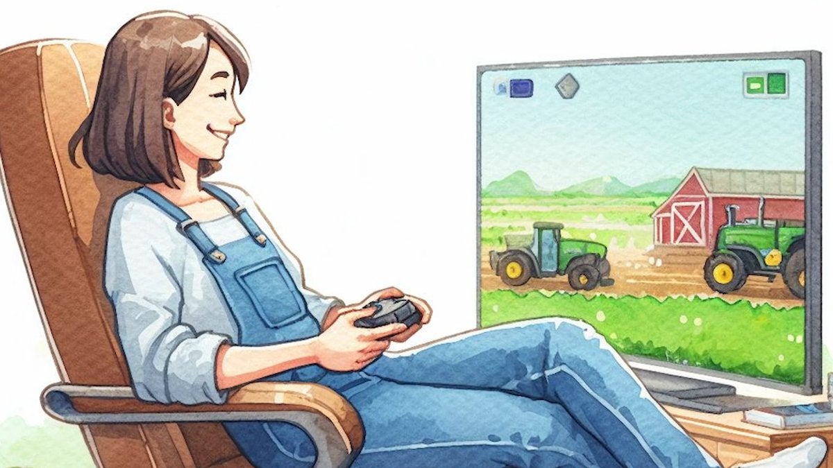 A young woman wearing denim overalls leaning back in a comfortable chair while holding a controller and using it to play a farming video game on a nearby monitor. The woman is smiling as the farm machines on-screen move around.