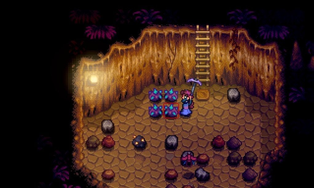 The player mining Iridium ore in the Skull Cavern to train the Mining skill. 