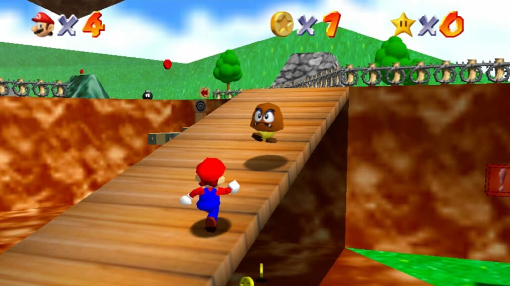 Mario running up a wooden ramp towards a goomba in Super Mario 64.