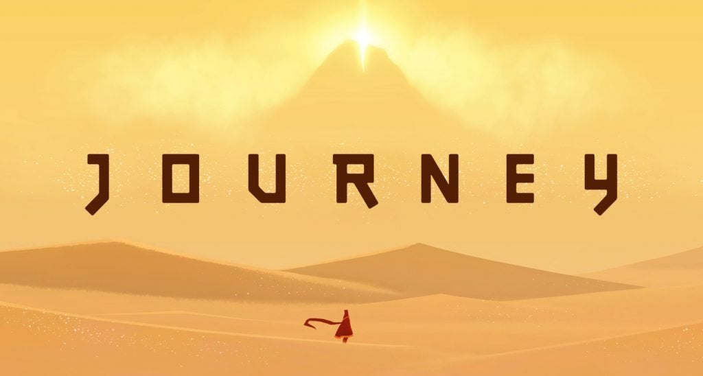The cover of Journey showing the mysterious, robed main character in front of a expansive desert and huge mountain.