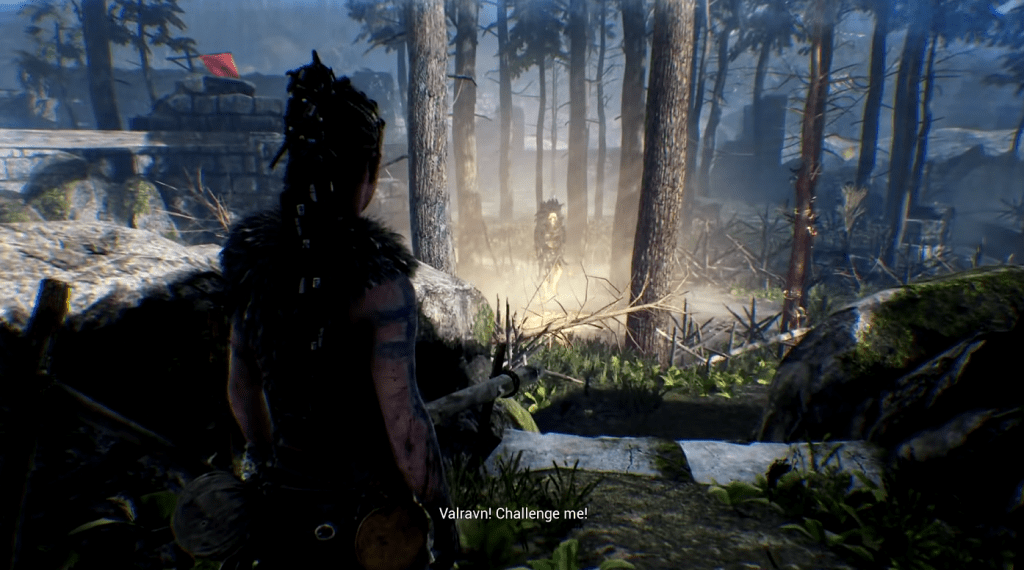 Senua, the main character of Hellblade: Senua's Sacrifice, preparing to face off against a skull-headed enemy in a dark forest.