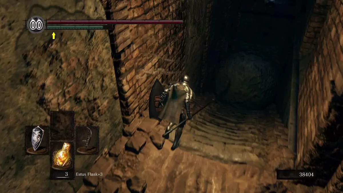 The Chosen Undead running a flight of stairs and following a rolling boulder.