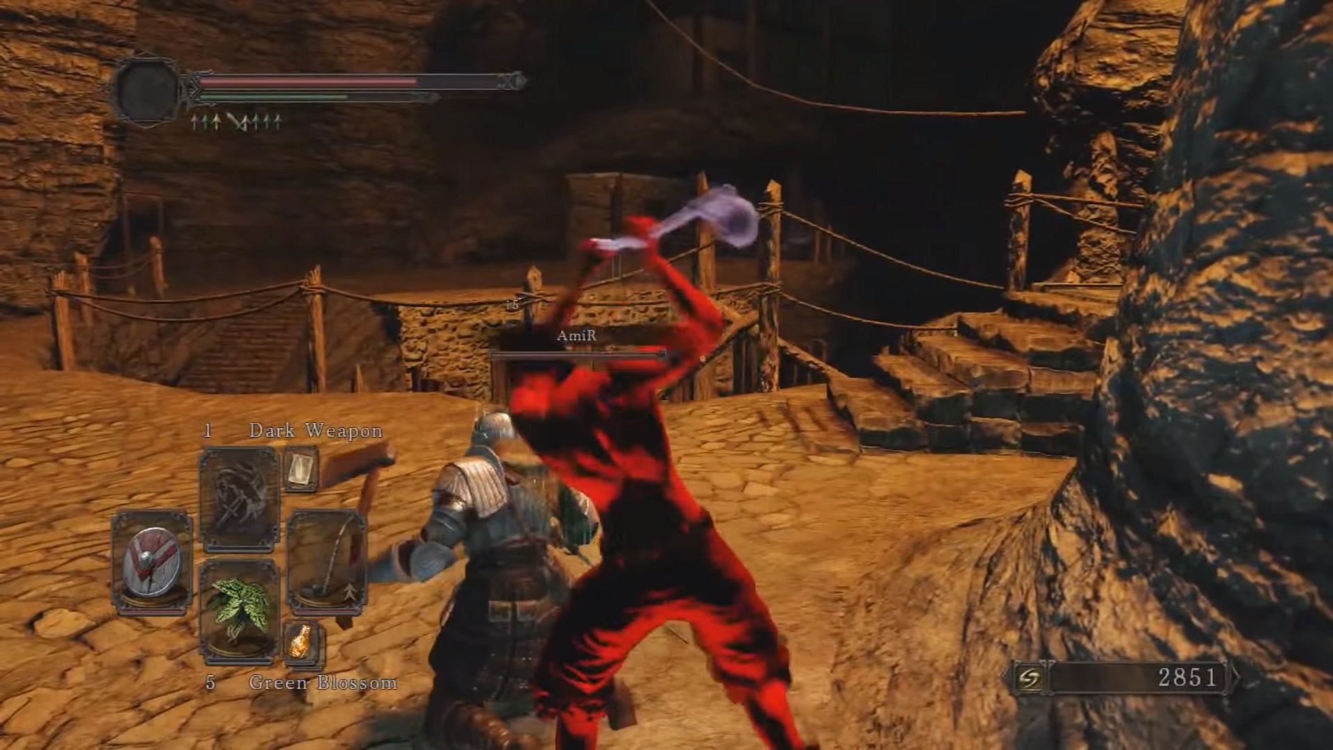 A player hitting another player in the back with a ladle in Dark Souls 2.