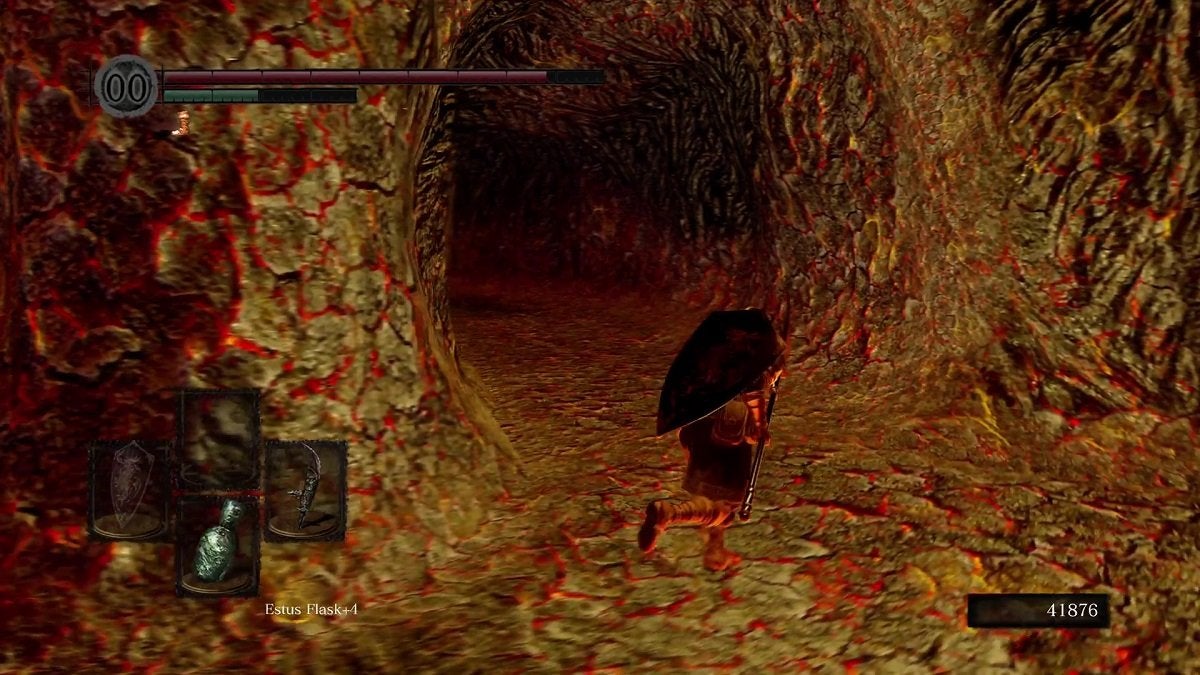 The Chosen Undead running towards a cave that leads to Lost Izalith.