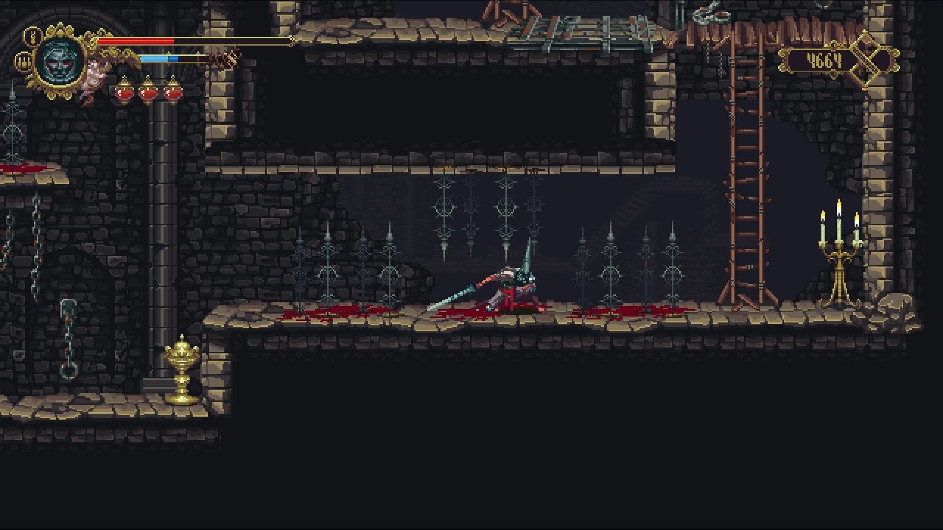 The player ducking under spikes in a narrow hallway in Blasphemous.