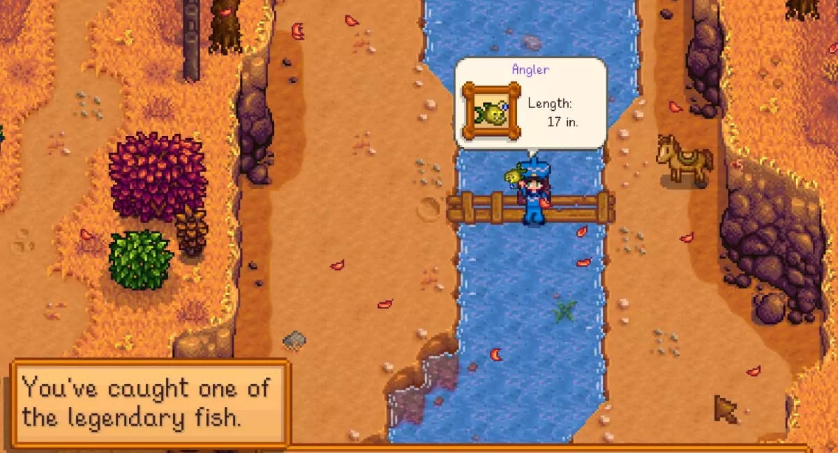 The player holding the yellow and big-eyed Angler fish above their head after catching it in Stardew Valley.