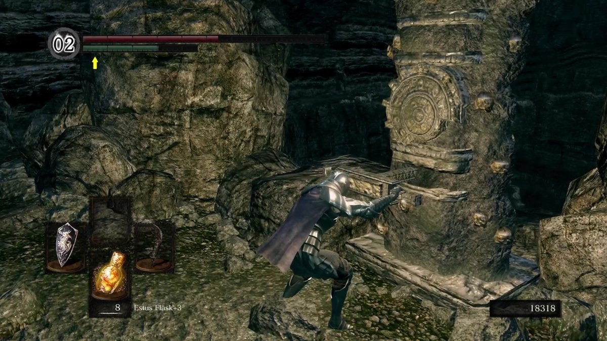The Chosen Undead activating a lever in The Catacombs of Dark Souls.