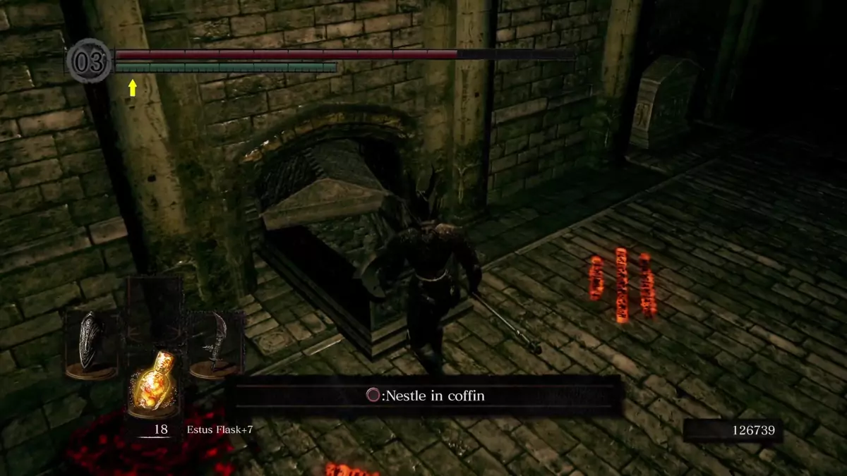 The Chosen Undead standing before a half-opened coffin in The Catacombs.