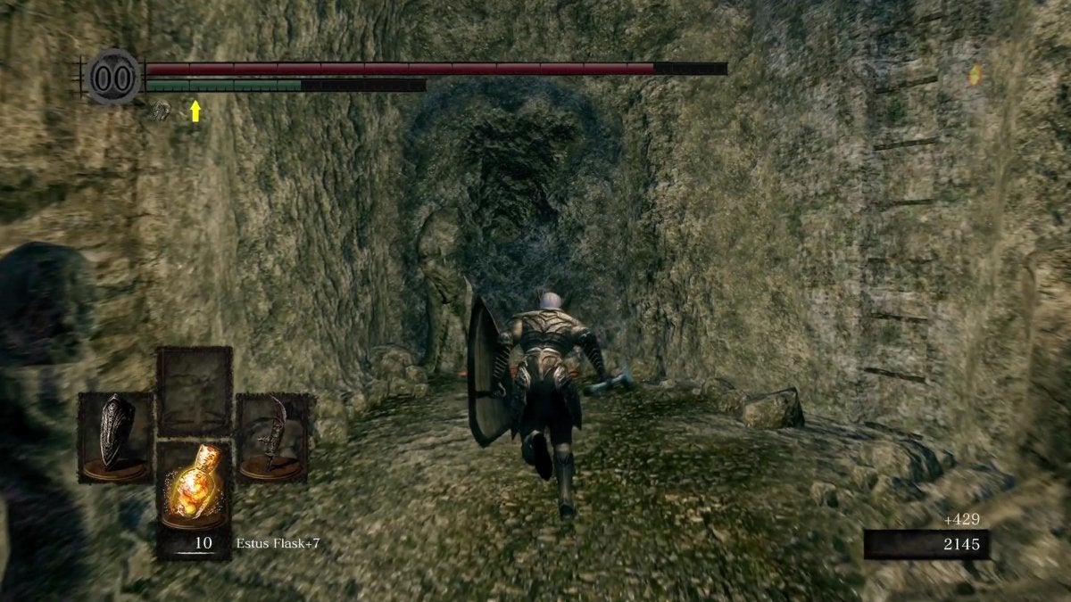 The Chosen Undead running towards an illusory wall in The Catacombs.