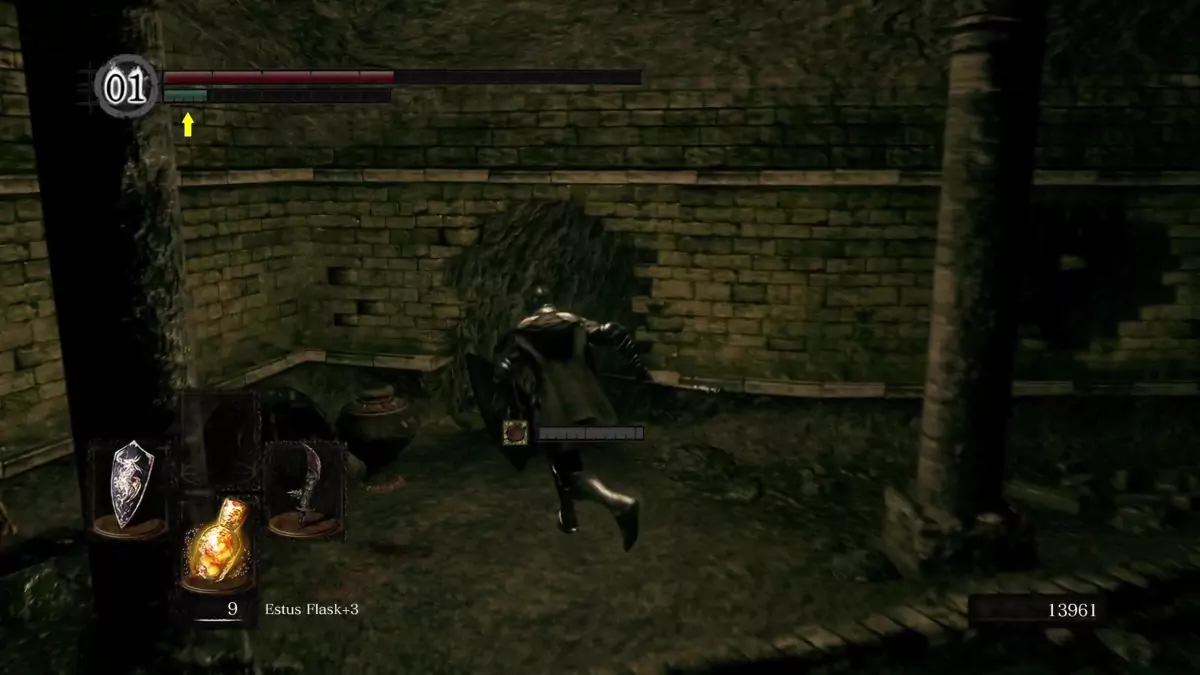 The Chosen Undead running towards a hole in the wall in The Catacombs.