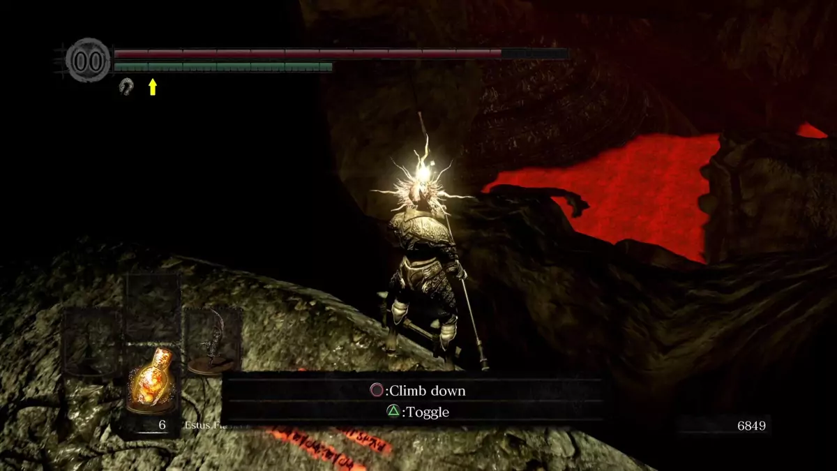 The Chosen Undead standing close to the edge of a cliff in the Tomb of Giants.