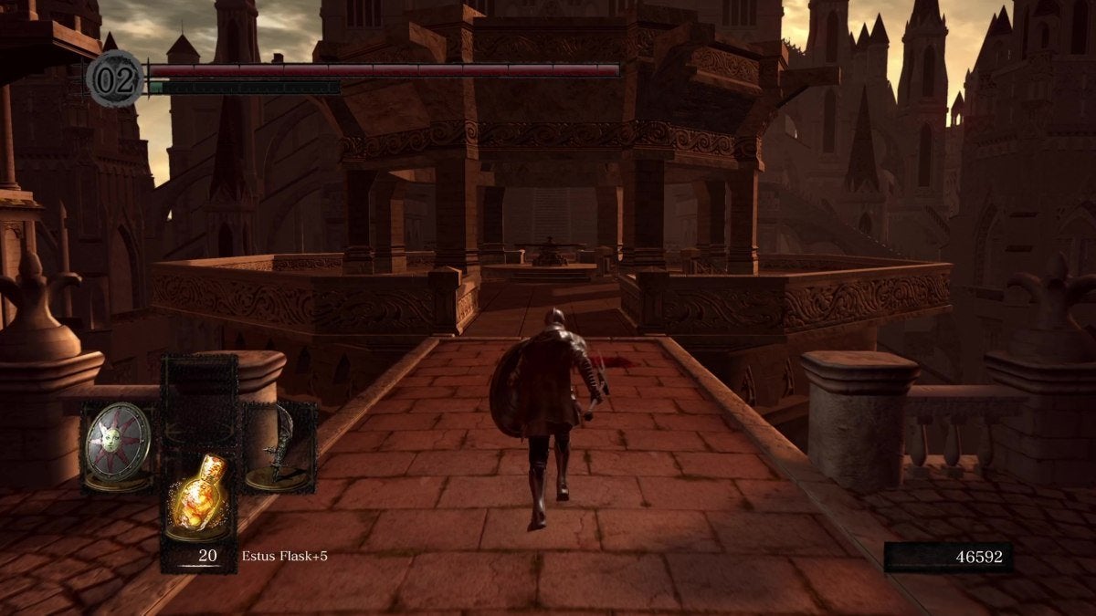 The Chosen Undead running towards a tower in Anor Londo.