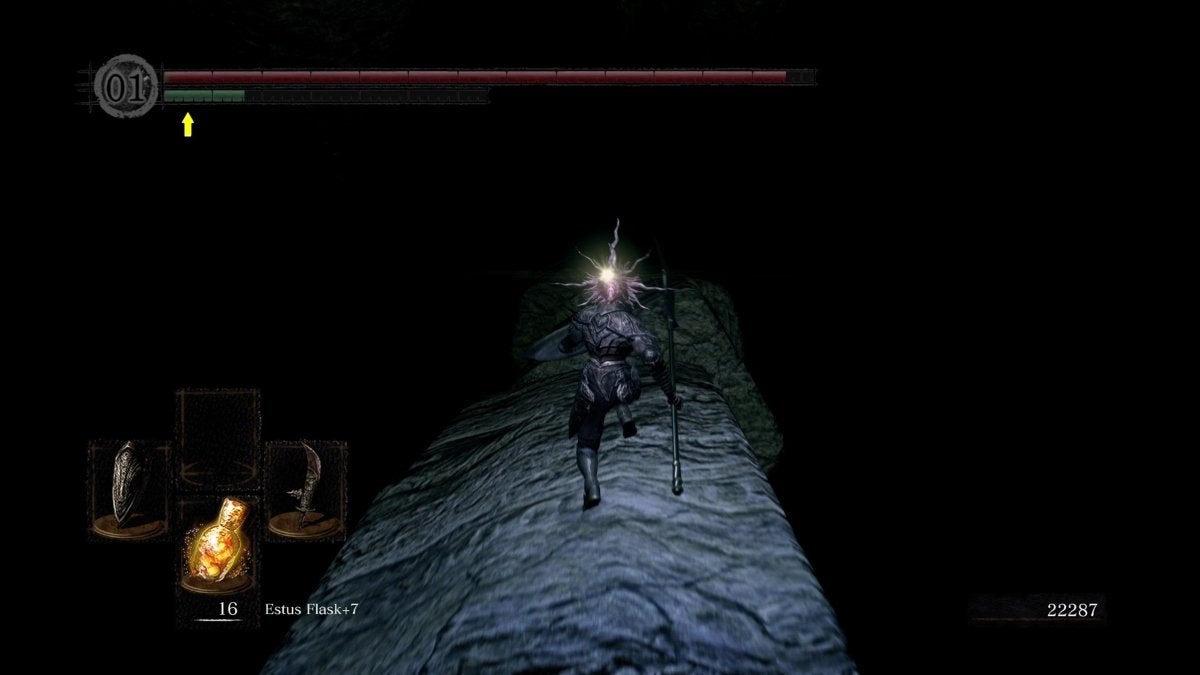 The Chosen Undead running on a fallen pillar in the dark.