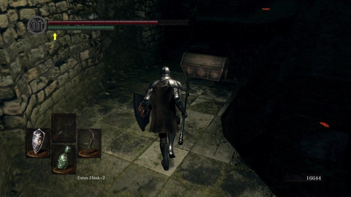 The Chosen Undead facing the chest that holds the Very Large Ember in Dark Souls.