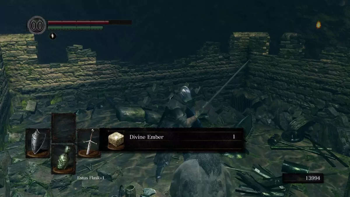The Chosen Undead picking up the Divine Ember in Dark Souls.