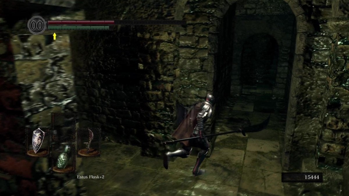 The Chosen Undead running towards a staircase in the New Londo Ruins.