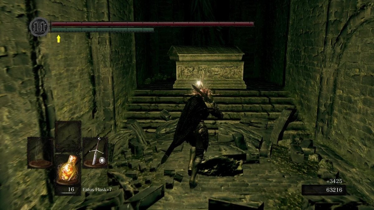 The Chosen Undead approaching a coffin in the Tomb of the Giants.