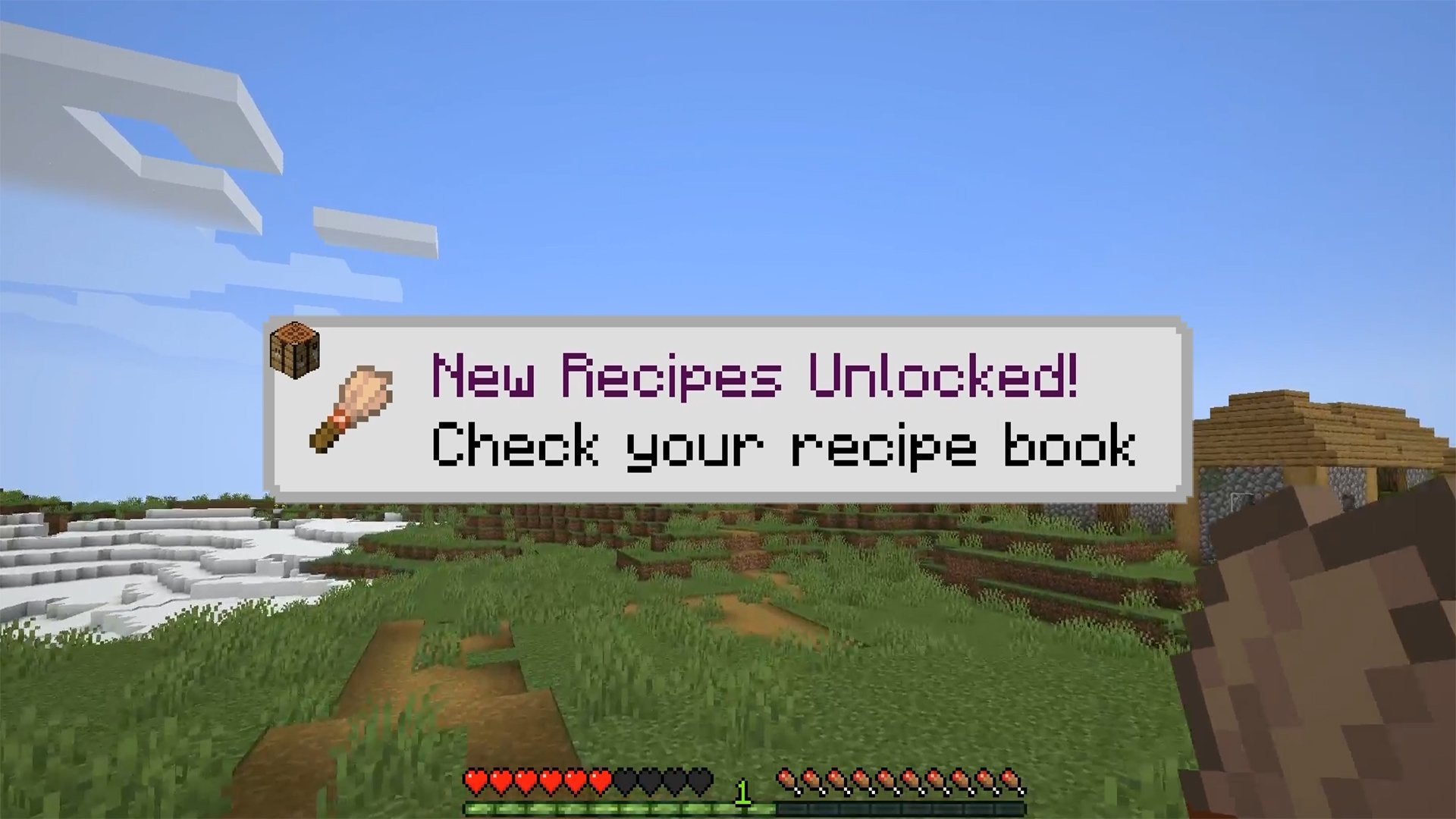A pop-up telling the player that they unlocked the recipe for crafting a Brush in Minecraft.