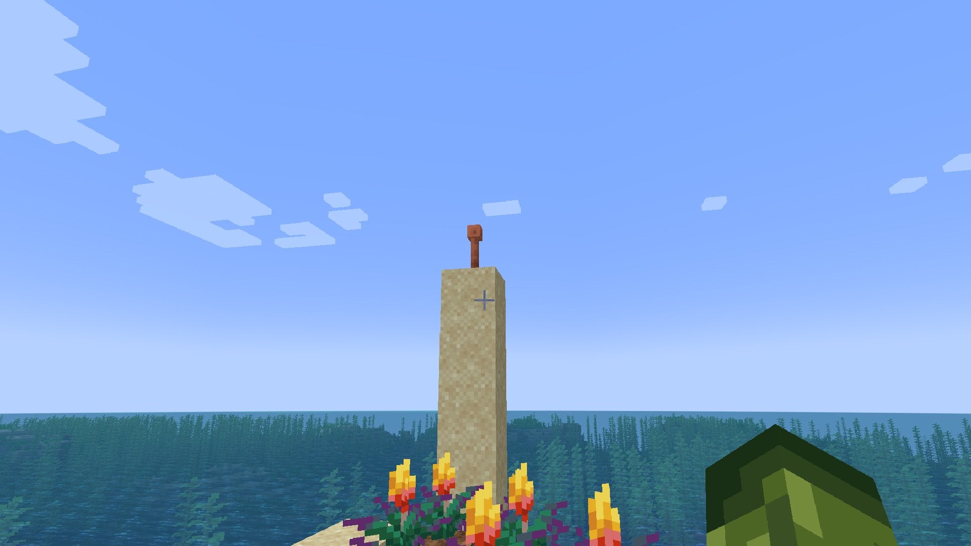A Lightning Rod on top of a tower of Sand blocks.