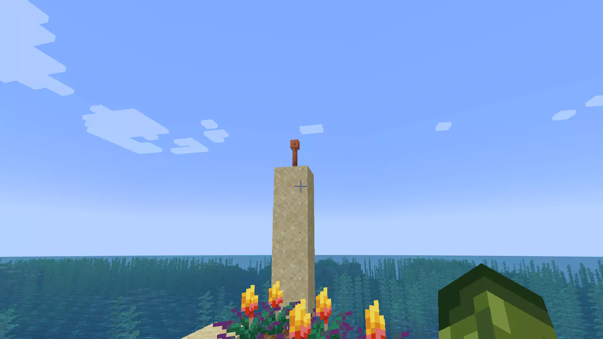 A Lightning Rod on top of a tower of Sand blocks.