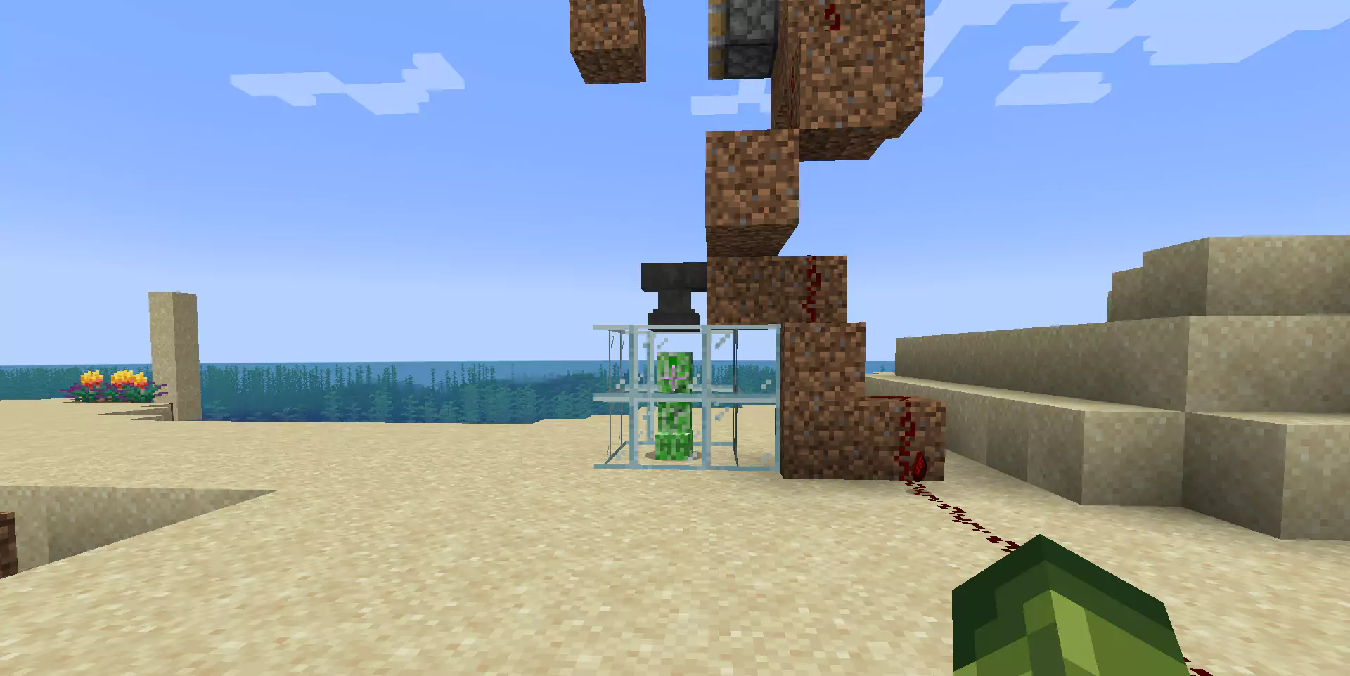 The player dropping an Anvil on a Creeper.