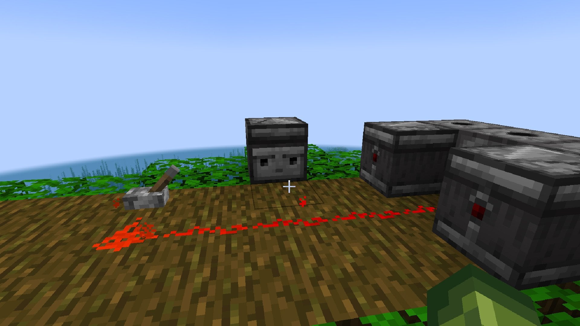 An Observer facing the player across from a lit-up line of Redstone Dust.